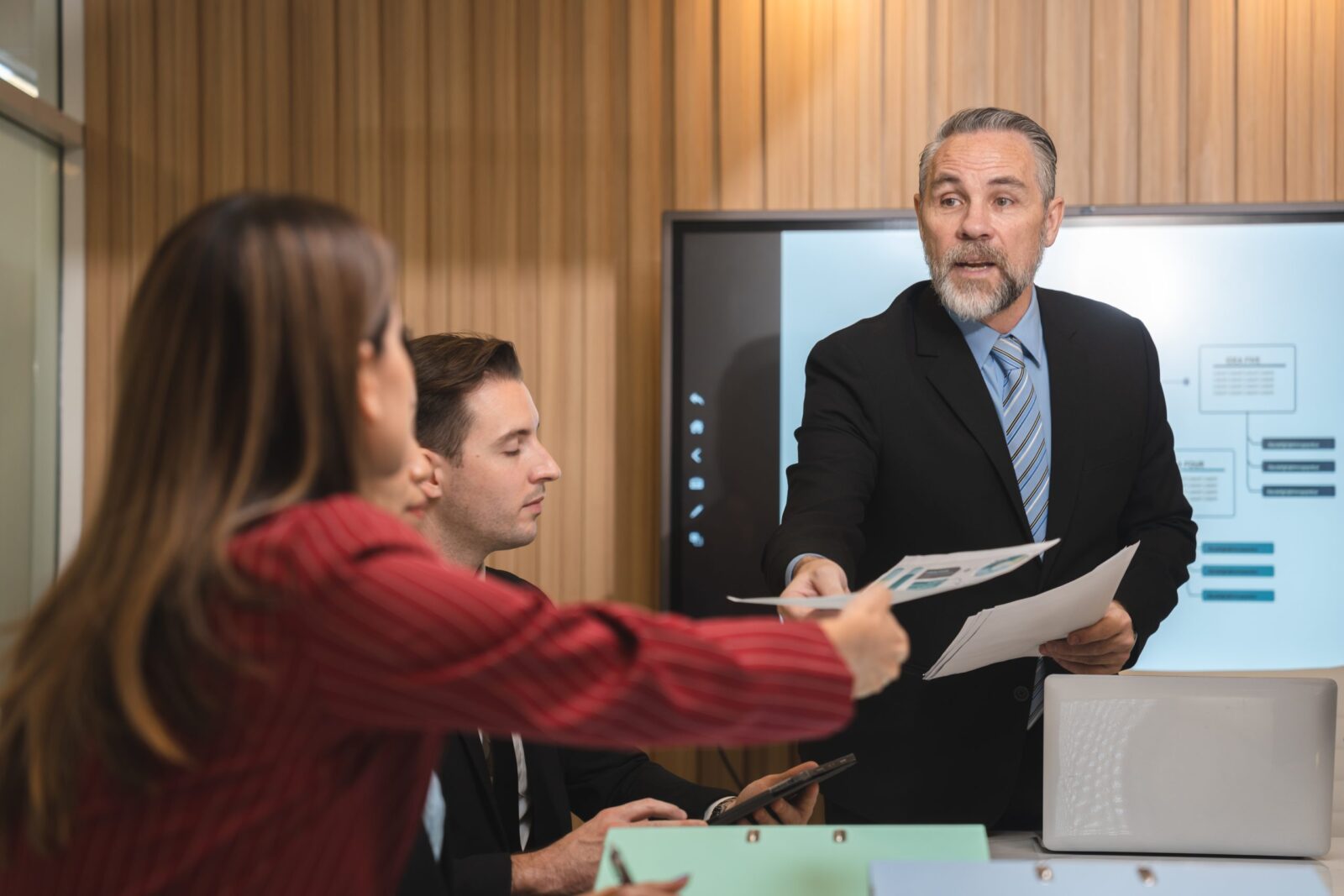 Three solicitors discussing selective licensing