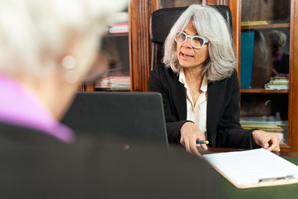 A solicitor explaining company formations and shareholder agreements with a client