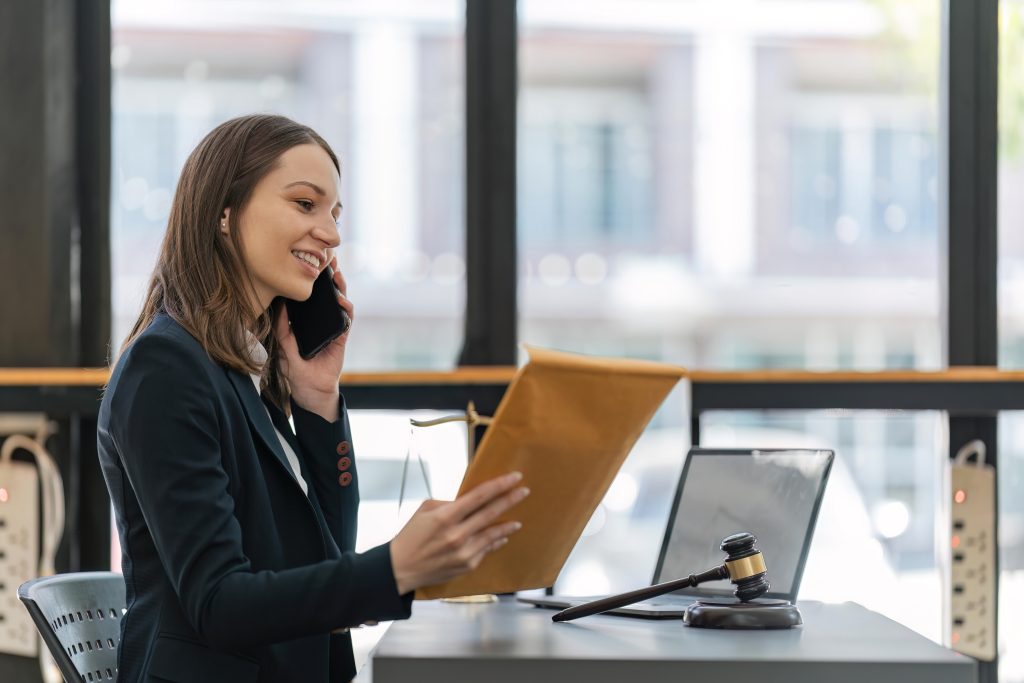A solicitor speaking to a client on the phone about property rights and disputes