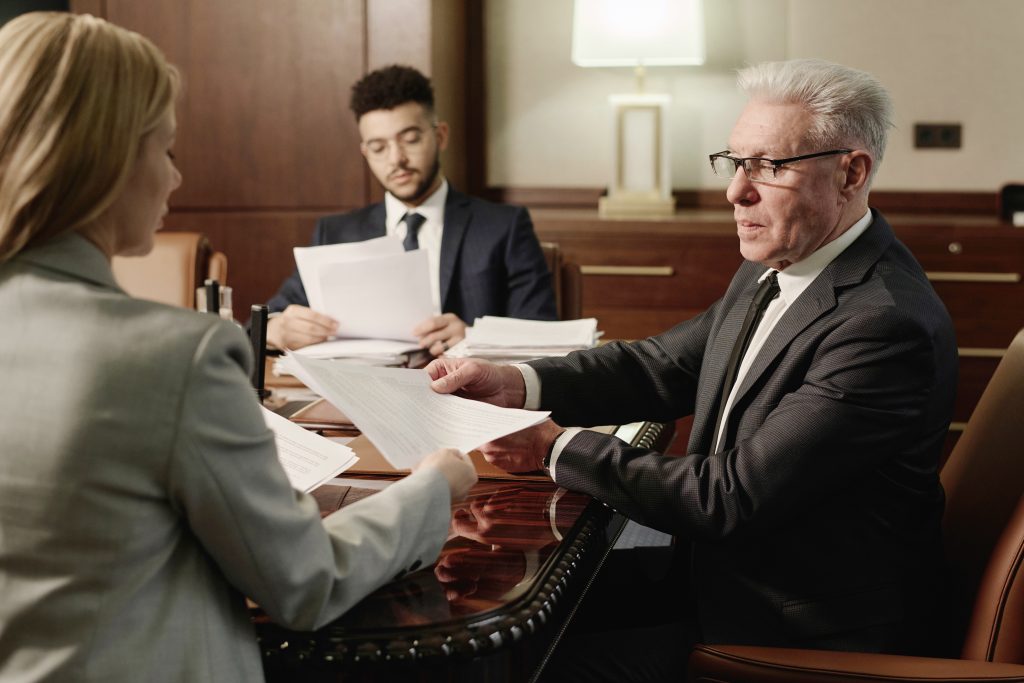 Three solicitors discussing powers of attorney