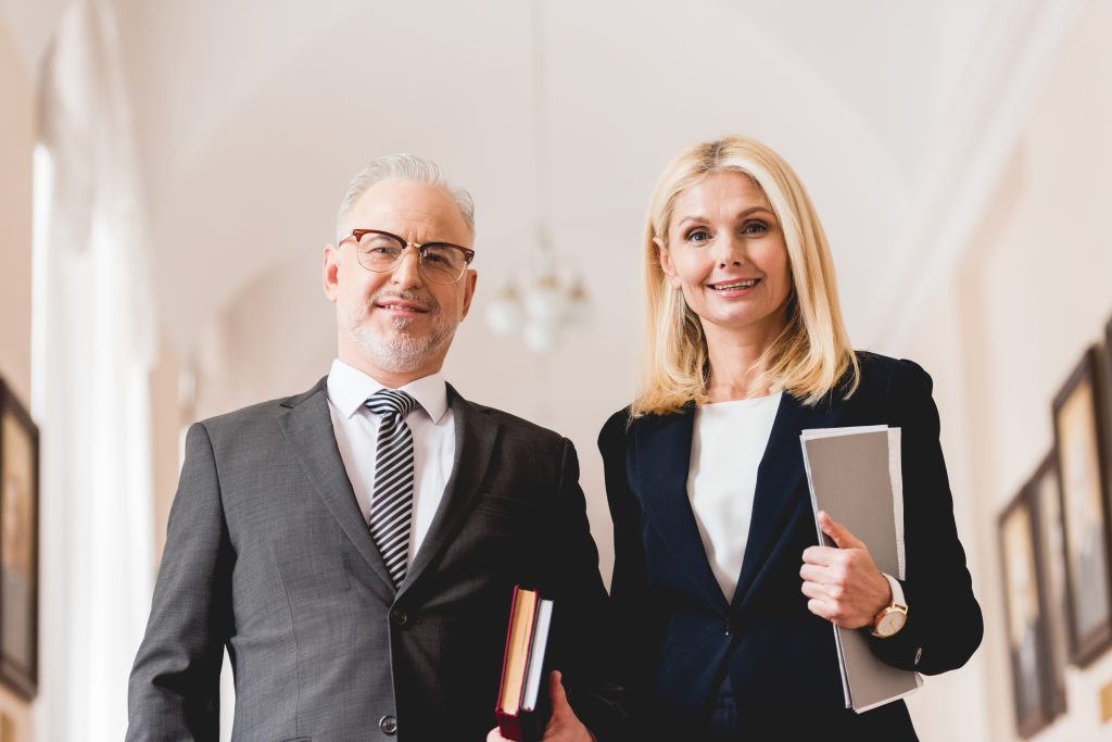 Two accelerated possession claims solicitors standing next to eachother