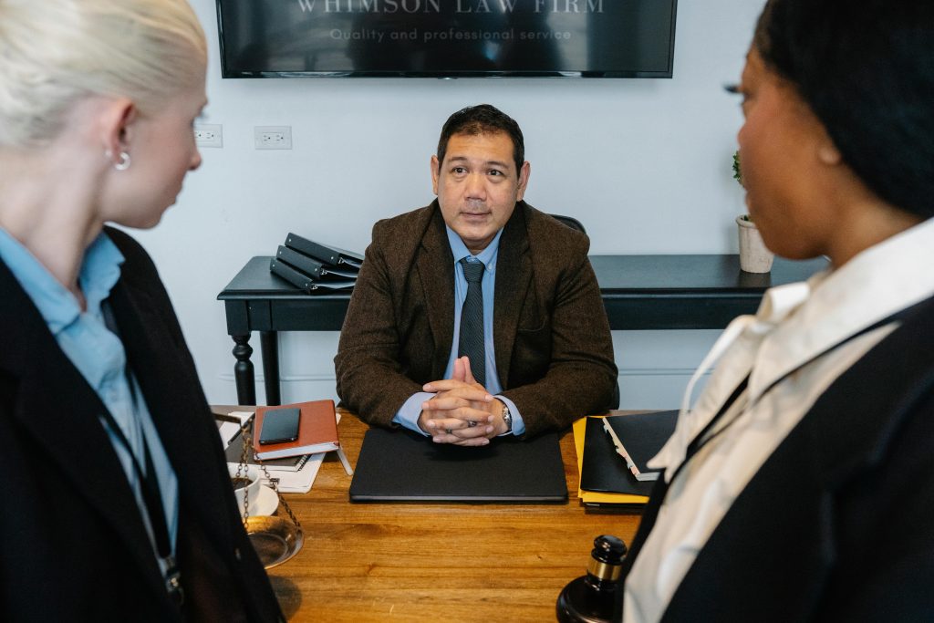 Three solicitors debating legal services Enfield
