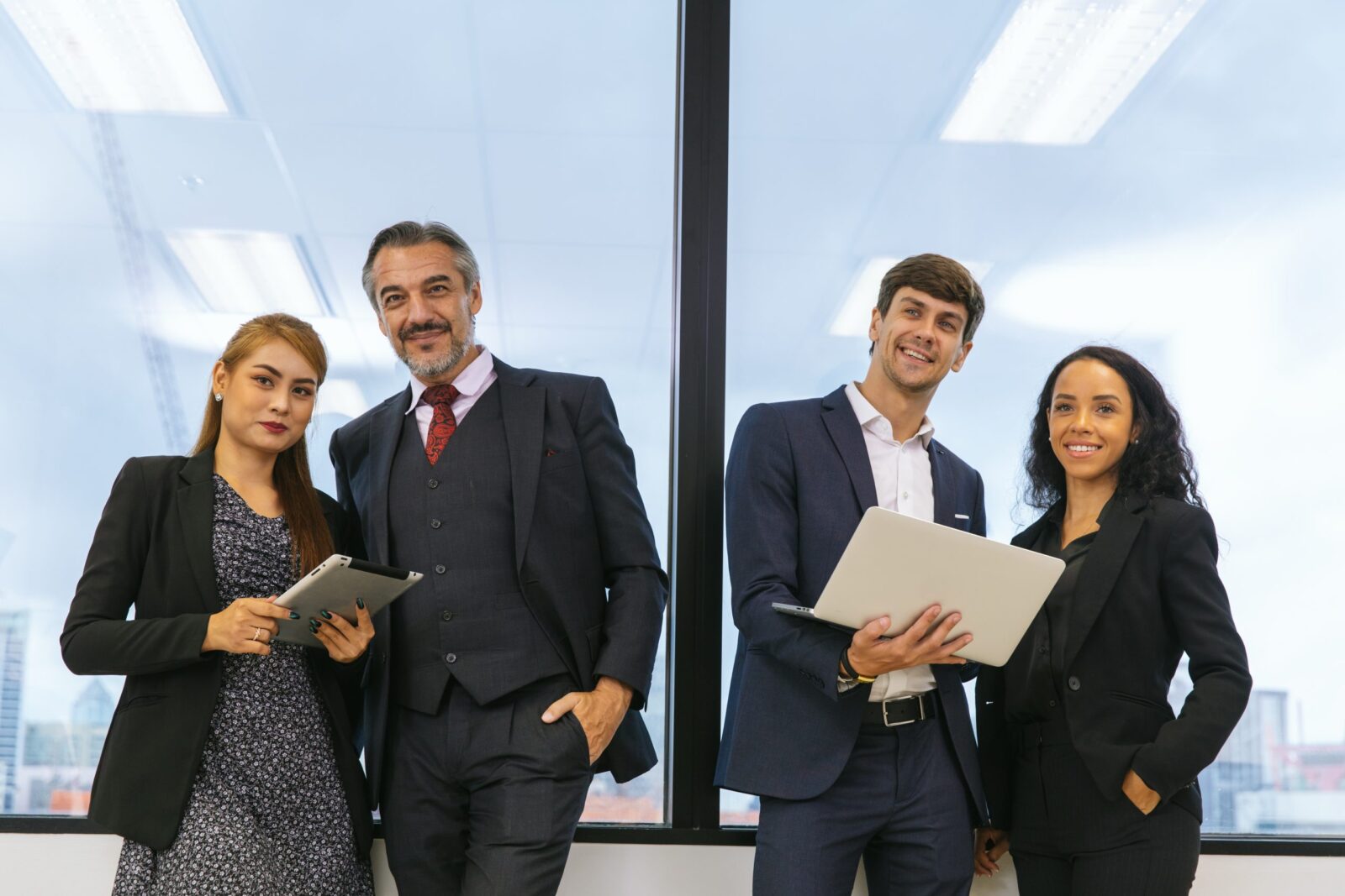 Four solicitors talking about Please contact us if you have any questions on freehold and leasehold property.